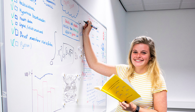Student Master Data Science for Life Sciences writes on board