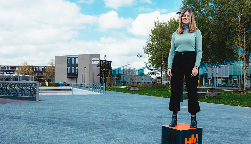 MSc in Business Studies student Silvia Panzani standing on master up box outside on campus