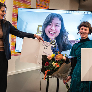 prijsuitreiking foto winnaars en wethouder