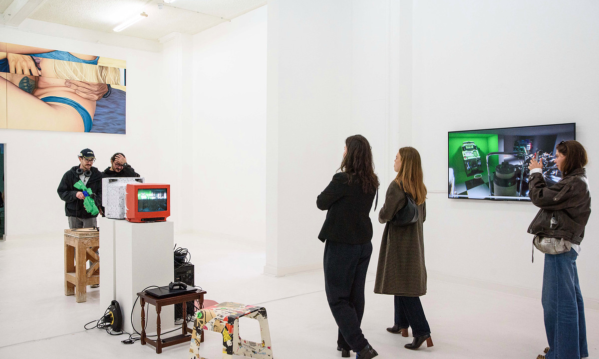 People viewing art at the grad show in 2024