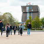 Group of students walking with Van OlstBorg in background.jpg