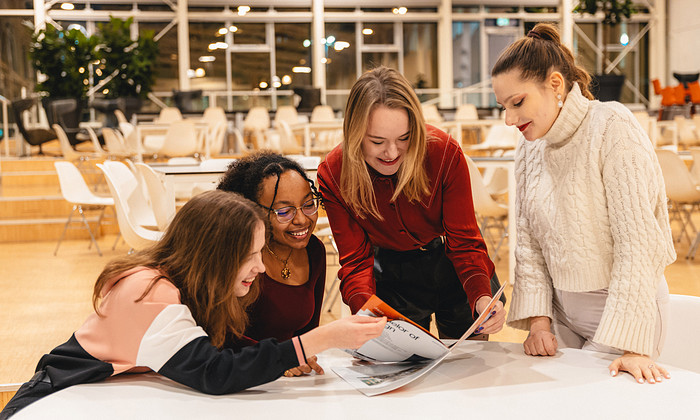 students reading at table