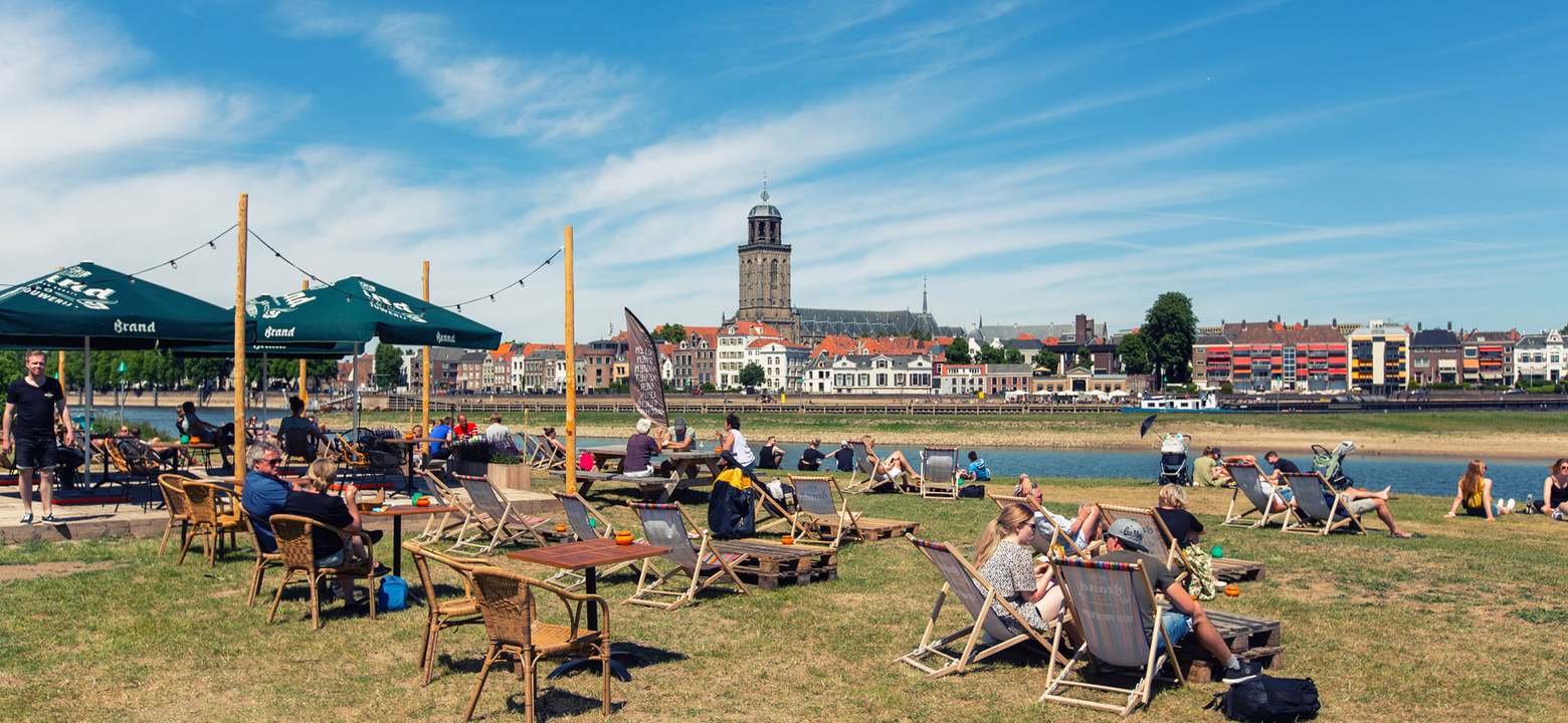 Sun loungers near the river the IJssel at the terrace of Meadow