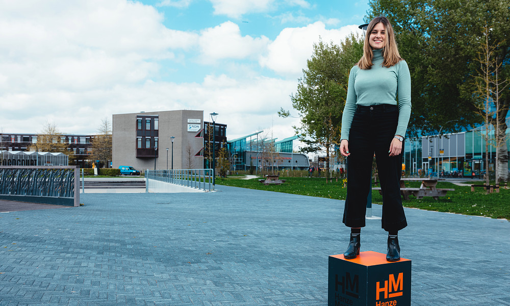 MSc in Business Studies student Silvia Panzani standing on master up box outside on campus